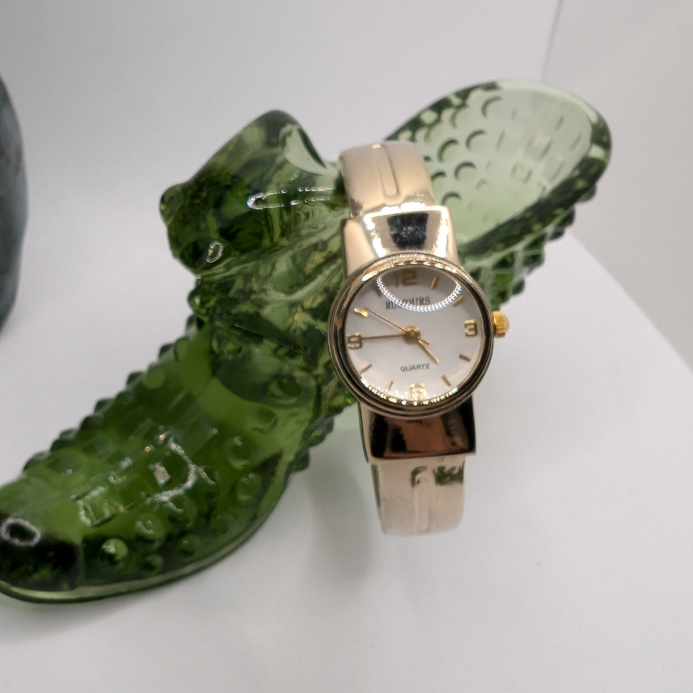 Ladies Rumors quartz face gold tone cuff watch